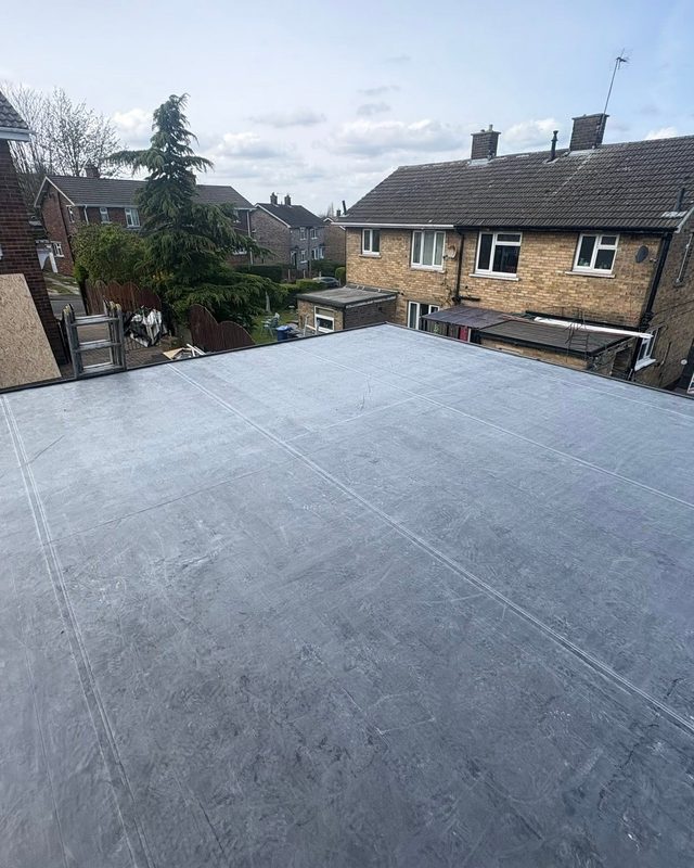 New rubber flat roof with fresh fascias and guttering by AC Roofing