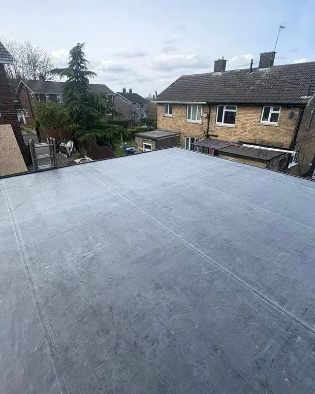 New rubber flat roof with fresh fascias and guttering by AC Roofing