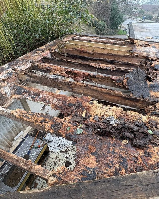 Perished roof timbers and old felt roof before AC Roofing rebuilt it