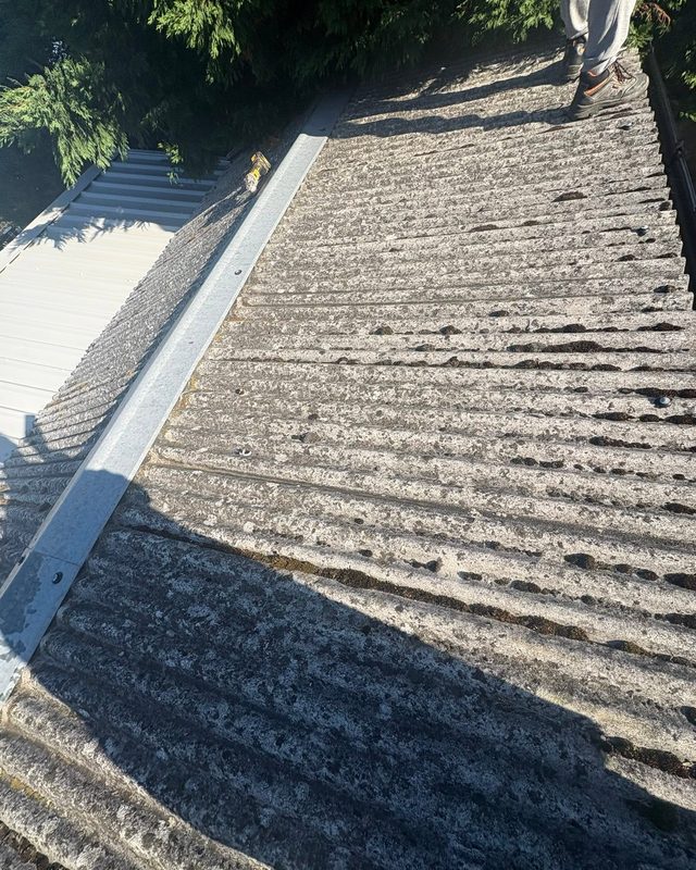 Old asbestos garage roof before replacement by AC Roofing in Wakefield