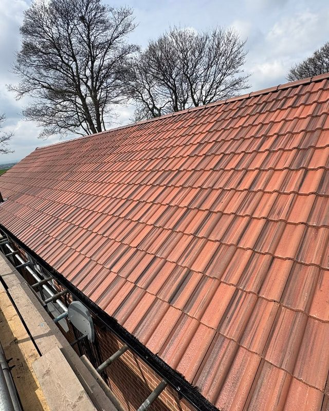 Restored pitched tiled roof by AC Roofing