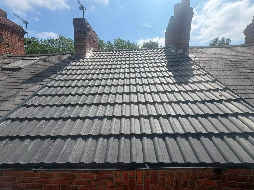 Cleaned and repointed tiled roof by AC Roofing
