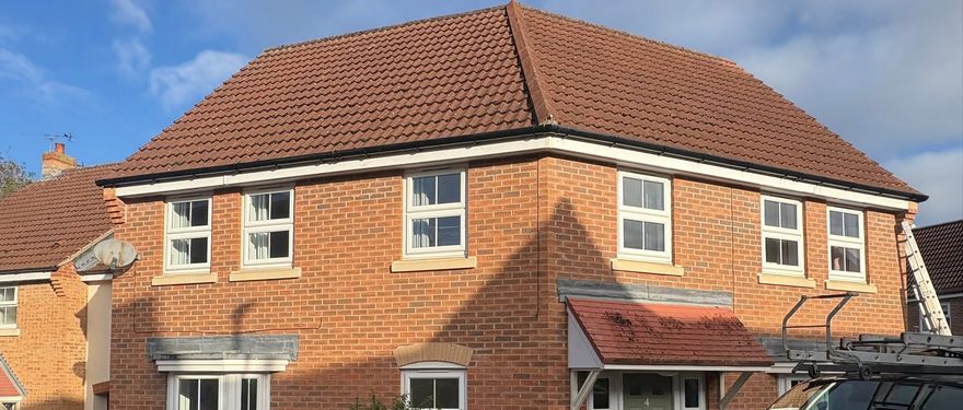 New white fascias, soffits and guttering on a Yorkshire semi by AC Roofing