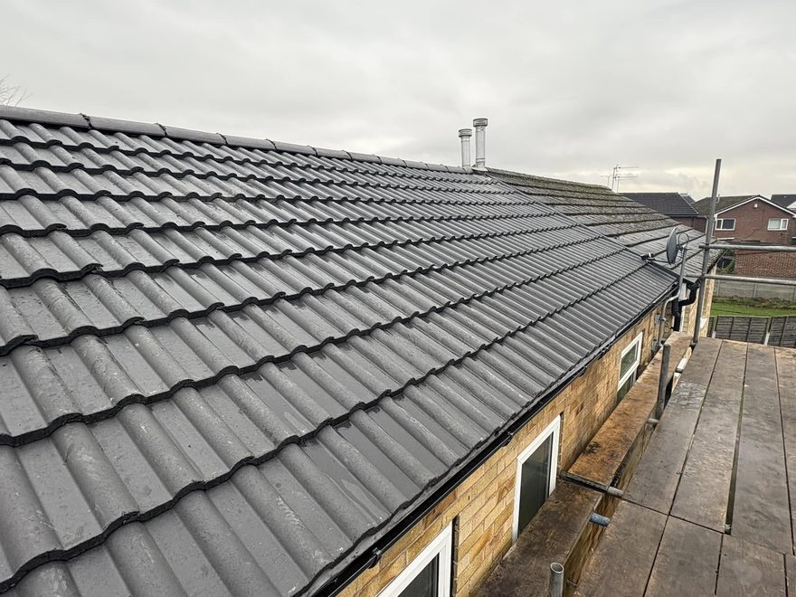 Newly installed charcoal tiled roof by AC Roofing